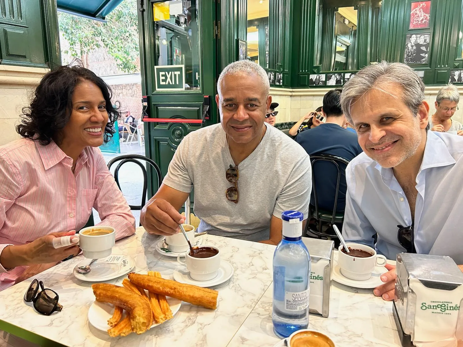 DIA Board Chair Lane Coleman and his wife Leigh Chandler eating churros with DIA Director Salvador Salort-Pons in Madrid last spring.